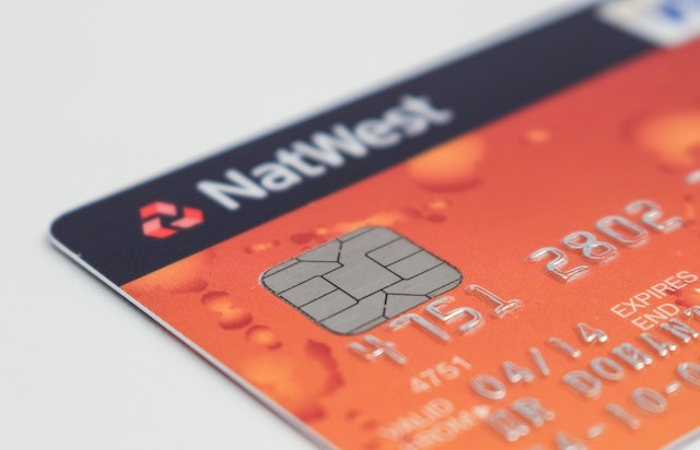 Close-up view of an orange credit card
