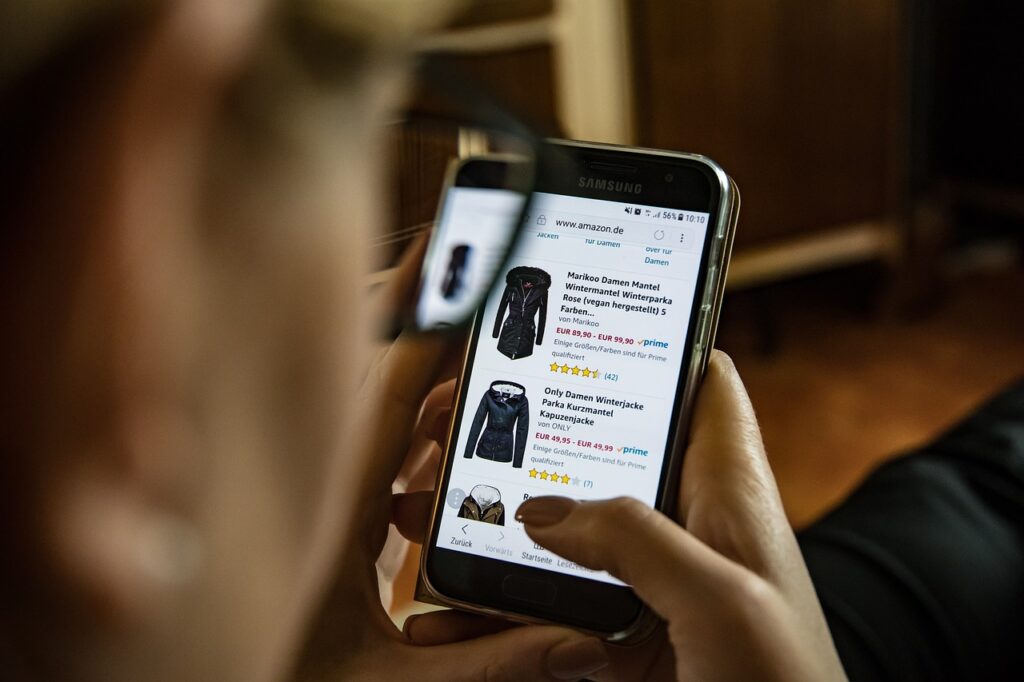  Woman online shopping from her phone
