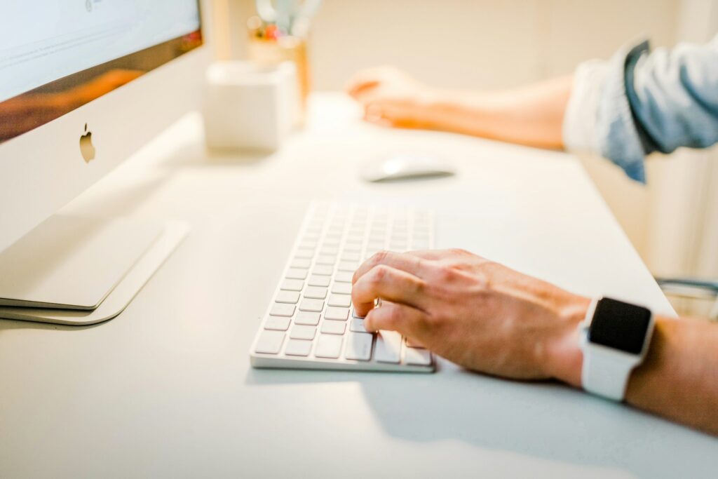 Hands typing on a keyboard searching for unusual online business ideas